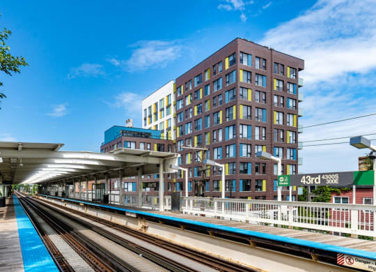a rendering of a building with a train track