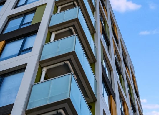 a tall building with a blue sky in the background