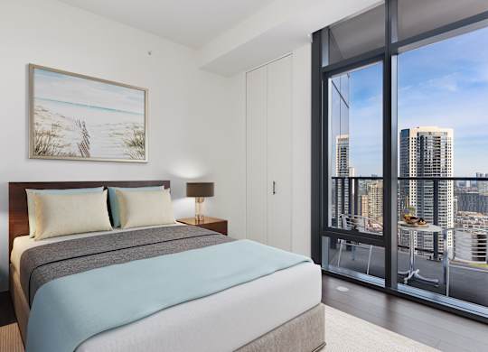 a bedroom with a bed and a large window at Cassidy on Canal, Chicago, IL, 60606