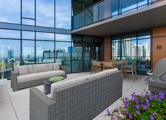 a living room with couches and a table in front of glass walls at Cassidy on Canal, Illinois, 60606