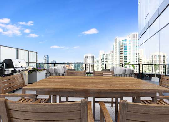 a communal table on a balcony with a view of the city at Cassidy on Canal, Illinois