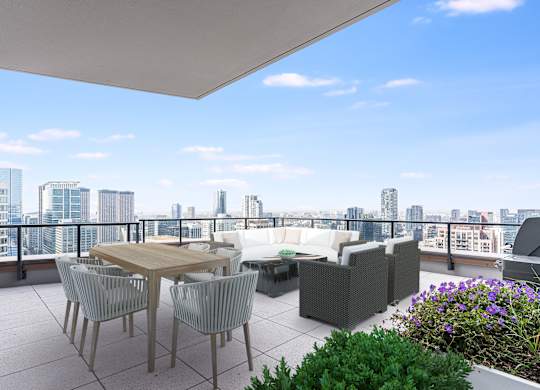 a balcony with a view of a city and a table and chairs at Cassidy on Canal, Chicago, Illinois, 60606