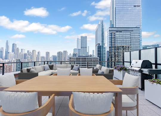 a communal terrace with a view of the city and a table and chairs at Cassidy on Canal, Chicago, Illinois, 60606