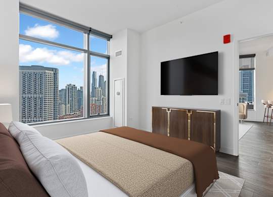 a bedroom with a bed and a large window at Cassidy on Canal, Chicago, IL, 60606