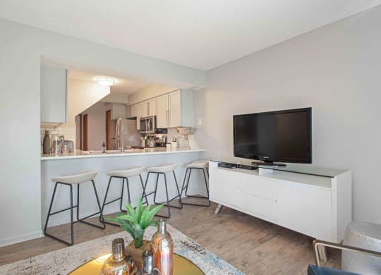 a living room with a bar and a television at Seasons Villas, Woodbury Minnesota