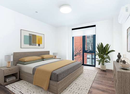 A bedroom with a large bed and a painting on the wall.