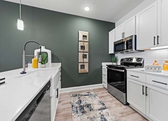 Kitchen with stove top oven at Views at Flowers, Clayton, North Carolina