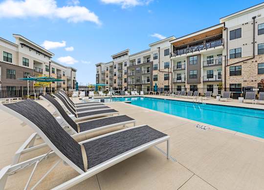 Pool with sun loungers at Views at Flowers, North Carolina, 27527