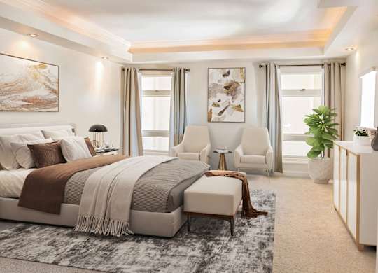 A bedroom with a large bed and a chair.