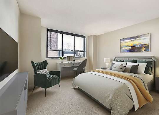 A bedroom with a large bed, a chair, and a painting on the wall.
