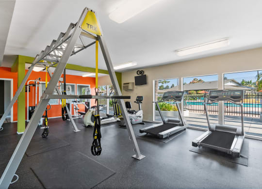 a room with gym equipment and two treadmills at Terramonte Apartment Homes, Pomona, 91767