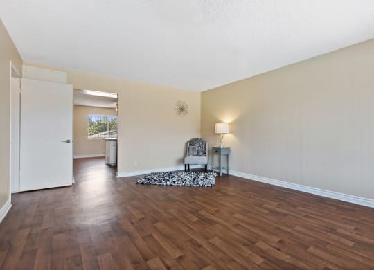 the spacious living room and dining room with hard wood flooring at Terramonte Apartment Homes, Pomona, CA, 91767