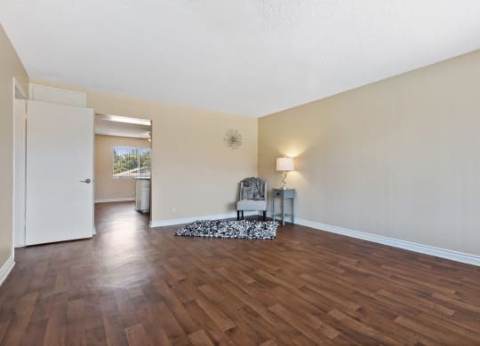 the spacious living room and dining room with hard wood flooring at Terramonte Apartment Homes, Pomona, CA, 91767