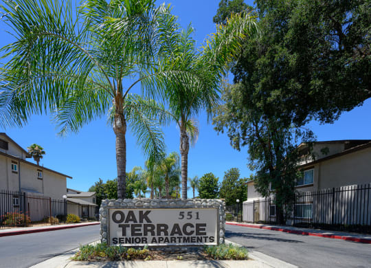 a sign that says oak terrace senior apartments at Oak Terrace Senior Apts, California