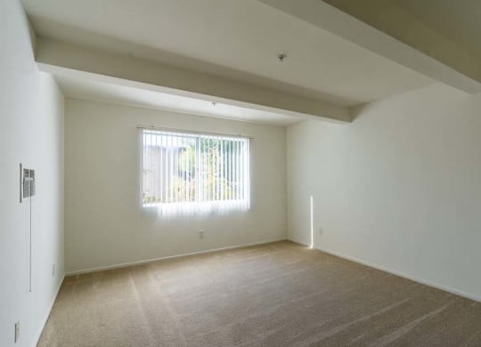 a large empty room with a large window at Mountainview Venture, Covina