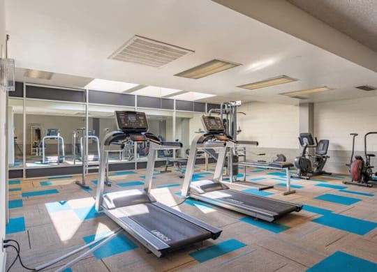 a gym with treadmills and other exercise equipment at Mountainview Venture, Covina