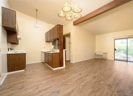 a kitchen and living room in a 555 waverly unit at Park Columbia Apts, Hemet, CA