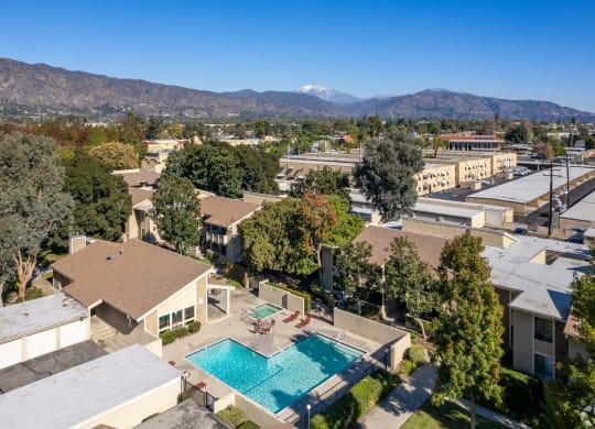 a aerial view of a pool and buildings in a city at Alosta Place, California, 91702