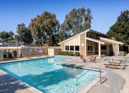 our apartments have a swimming pool and a patio with chairs at Alosta Place, Azusa, CA, 91702