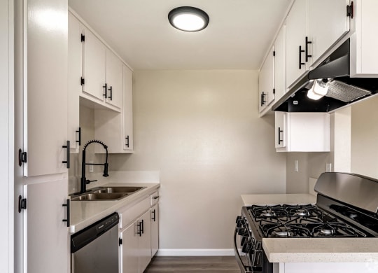 the preserve at ballantyne commons apartment kitchen with stove and sink at Colima Terrace Apts, Rowland Heights, CA 91748
