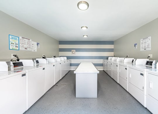 the laundry room is equipped with washers and dryers at Colima Terrace Apts, Rowland Heights, CA