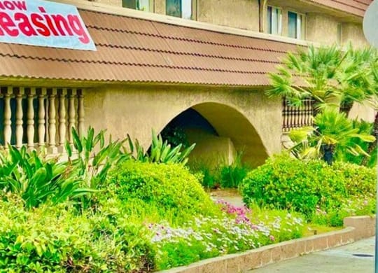 a building with a sign on the side of it at North View Terrace, Montebello, 90640