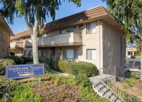 a building with a blue sign in front of it at North View Terrace, California, 90640