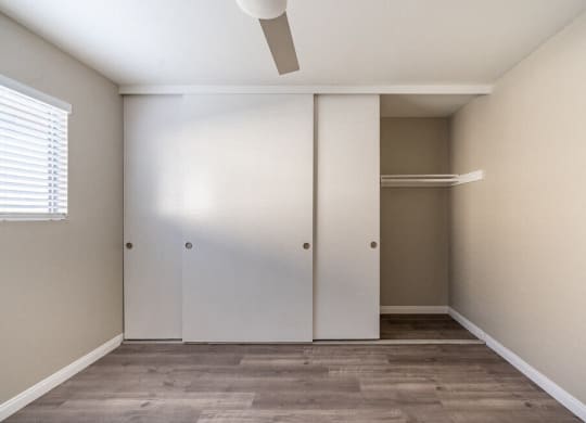 an empty room with a closet and a window at North View Terrace, Montebello