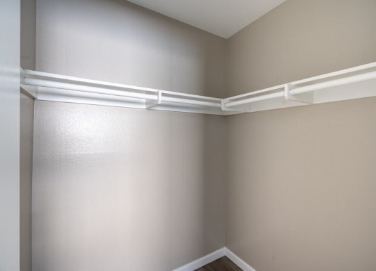 the corner of a room with white shelves on the wall at North View Terrace, Montebello, 90640