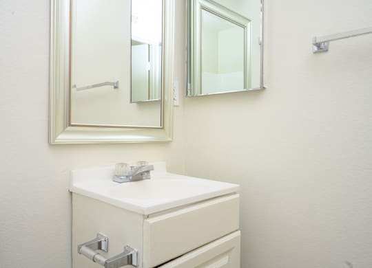 a bathroom with a sink and a mirror  at Villa Hemet, Hemet, CA 92543