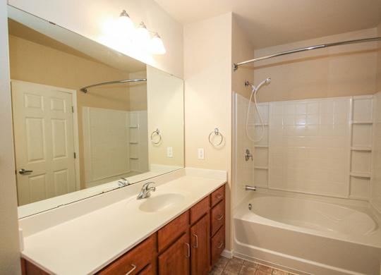 a bathroom with a bathtub and a sink