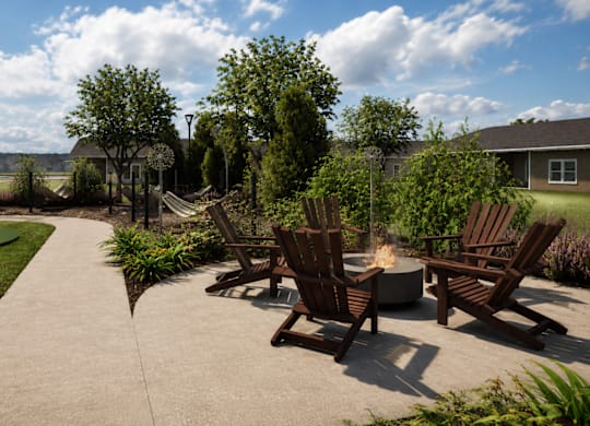 A patio with chairs and a fire pit.