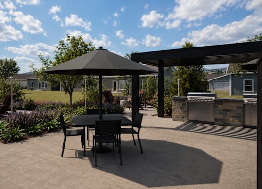 A patio with a table and chairs under a gazebo.