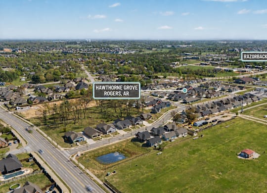 An aerial view of a residential area with two streets named Hawthorne Grove and Rogers Ave.