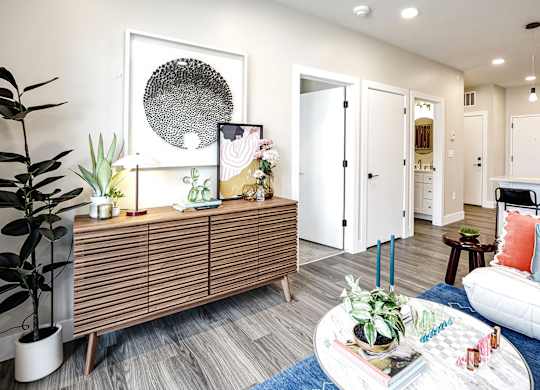 Brand new modern studio, one and two-bedroom apartment homes featuring stainless steel appliances, tile backsplash, quartz countertops, LVP flooring, large picture windows, in-unit washer and dryer and balconies at The Artisan at 39th in Omaha, NE