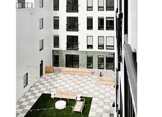 Brand new modern studio, one and two-bedroom apartment homes featuring stainless steel appliances, tile backsplash, quartz countertops, LVP flooring, large picture windows, in-unit washer and dryer and balconies at The Artisan at 39th in Omaha, NE