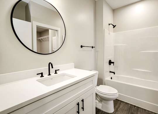 Brand new modern studio, one and two-bedroom apartment homes featuring stainless steel appliances, tile backsplash, quartz countertops, LVP flooring, large picture windows, in-unit washer and dryer and balconies at The Artisan at 39th in Omaha, NE