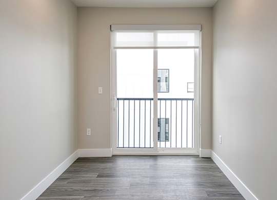 Brand new modern studio, one and two-bedroom apartment homes featuring stainless steel appliances, tile backsplash, quartz countertops, LVP flooring, large picture windows, in-unit washer and dryer and balconies at The Artisan at 39th in Omaha, NE