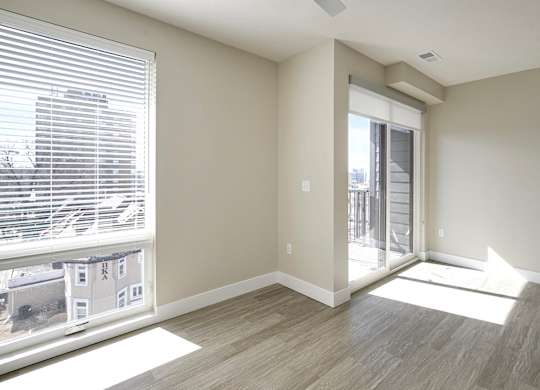 Brand new modern studio, one and two-bedroom apartment homes featuring stainless steel appliances, tile backsplash, quartz countertops, LVP flooring, large picture windows, in-unit washer and dryer and balconies at The Artisan at 39th in Omaha, NE