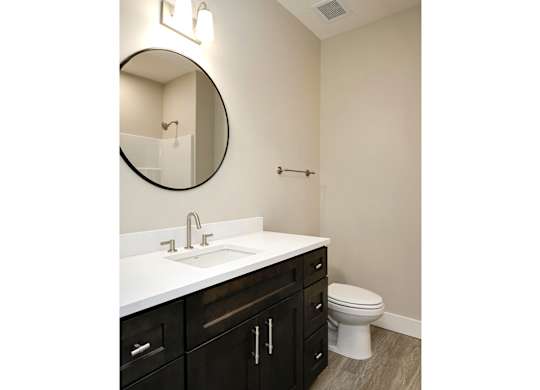 Brand new modern studio, one and two-bedroom apartment homes featuring stainless steel appliances, tile backsplash, quartz countertops, LVP flooring, large picture windows, in-unit washer and dryer and balconies at The Artisan at 39th in Omaha, NE