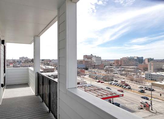 Brand new modern studio, one and two-bedroom apartment homes featuring stainless steel appliances, tile backsplash, quartz countertops, LVP flooring, large picture windows, in-unit washer and dryer and balconies at The Artisan at 39th in Omaha, NE