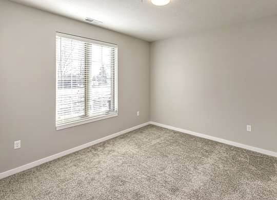 Bedroom at Deerfield Apartments and Chateaus in Fremont, NE