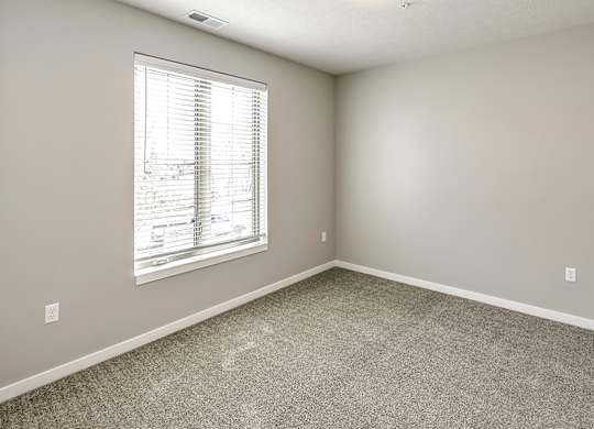 Bedroom at Deerfield Apartments and Chateaus in Fremont, NE