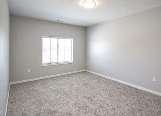Bedroom at Deerfield Apartments and Chateaus in Fremont, NE