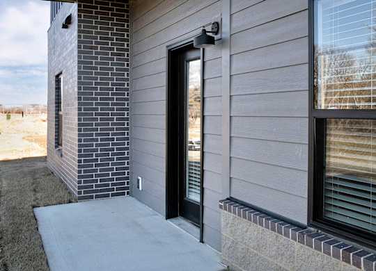 Modern one- and two-bedroom apartments featuring stainless steel appliances, high-end lighting, premium LVT flooring, granite countertops and more at The Ridgeline in Council Bluffs, IA