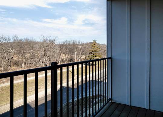 Modern one- and two-bedroom apartments featuring stainless steel appliances, high-end lighting, premium LVT flooring, granite countertops and more at The Ridgeline in Council Bluffs, IA