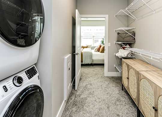 Walk-in closet with in-unit laundry at The Westline at Flanagan Lake in Omaha, NE