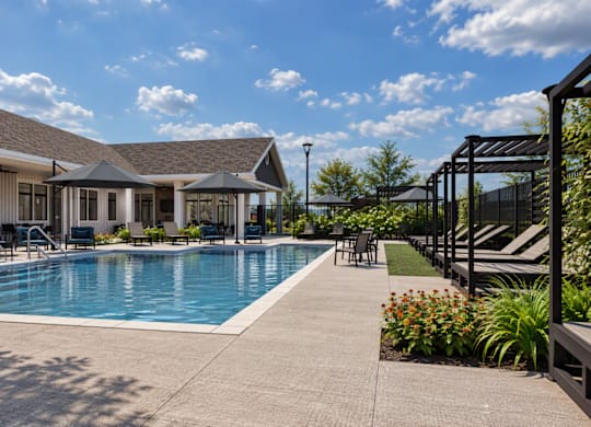 A pool area with a building in the background.