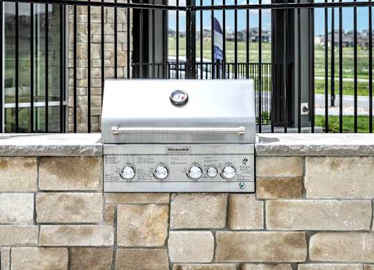 Outdoor grilling stations at The Westline at Flanagan Lake in Omaha, NE