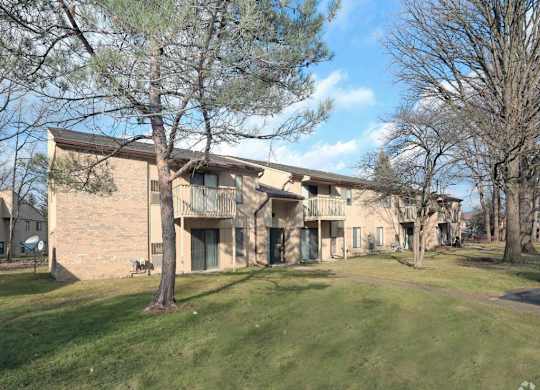 a building with a grassy area in front of it